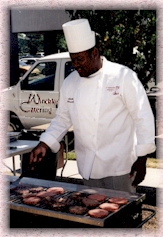 The chef, Michael Winckler, preparing an outdoor barbecue